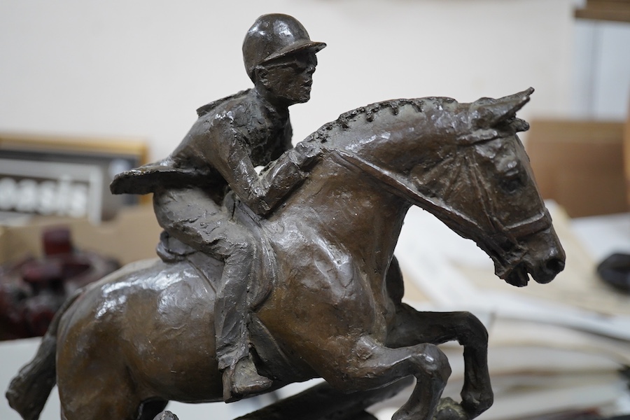 June Harrah (American), bronze group of a racehorse and rider, on a naturalistic green marble base, 30cm high, with paperwork including provenance and exhibition leaflet. Condition - good